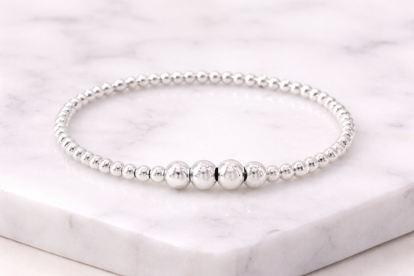 Sterling silver, elastic bracelet with 3mm and 5mm ball bead, 7″ in length