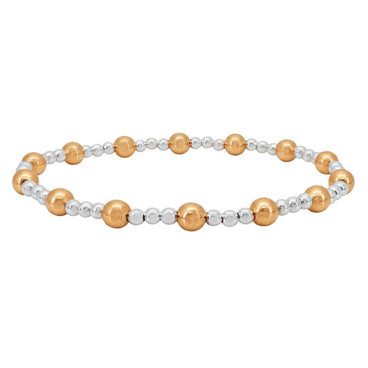 Elastic bracelet with 3mm sterling silver ball, 5mm 14KT gold filled ball, 7″ in length