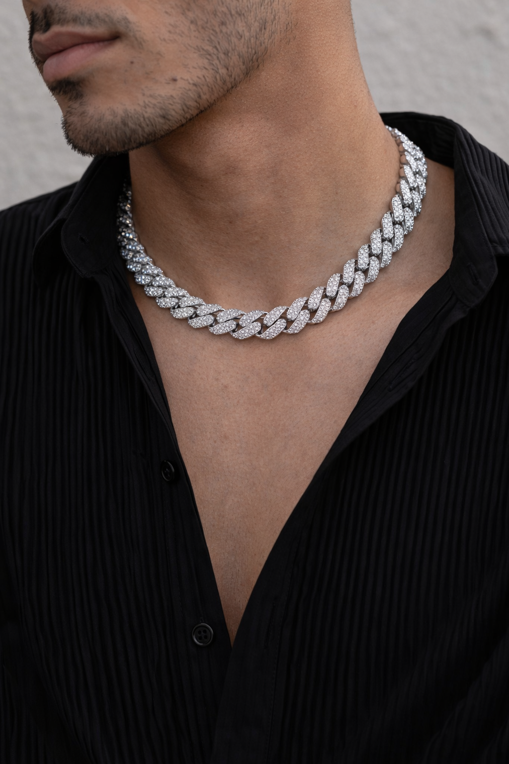 Sterling silver with rhodium, zig zag Cuban chain with cubic zirconia.