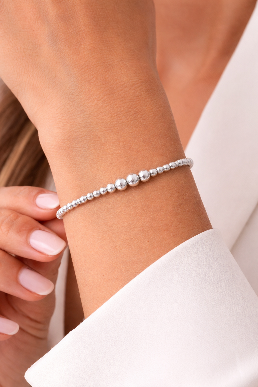 Sterling silver, elastic bracelet with 3mm and 5mm ball bead, 7″ in length