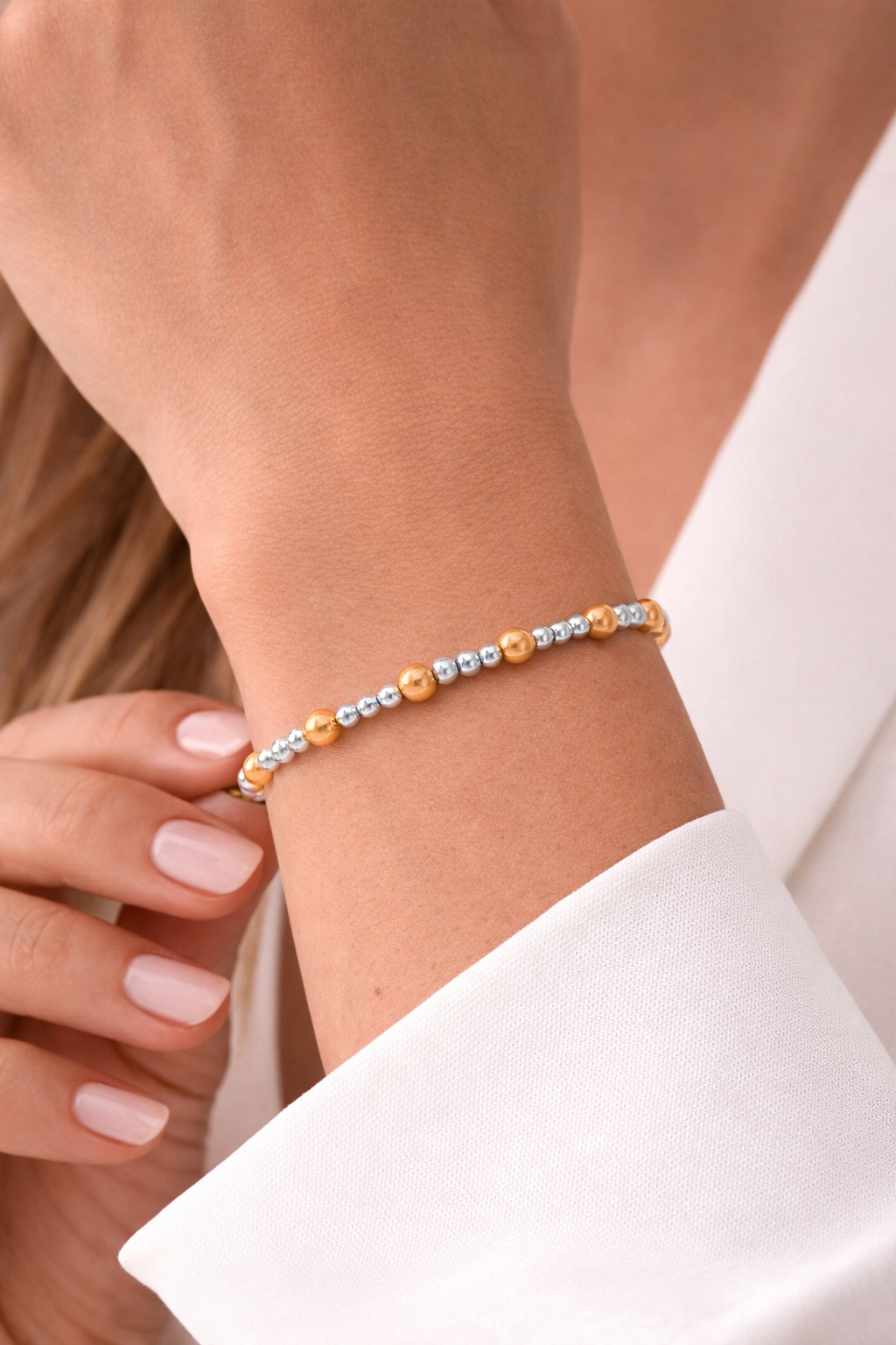 Elastic bracelet with 3mm sterling silver ball, 5mm 14KT gold filled ball, 7″ in length