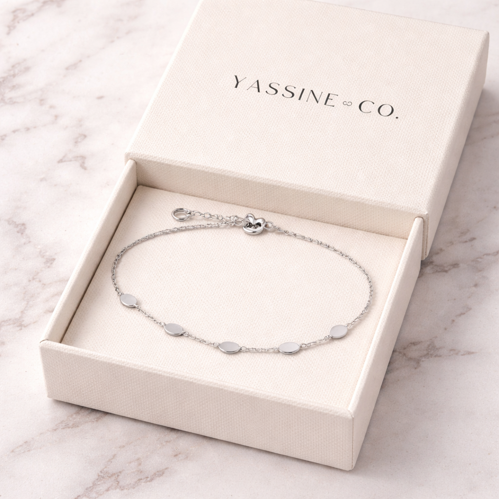 Sterling silver with rhodium, oval disc bracelet, 4mm width, 7″ + 0.5″ extension
