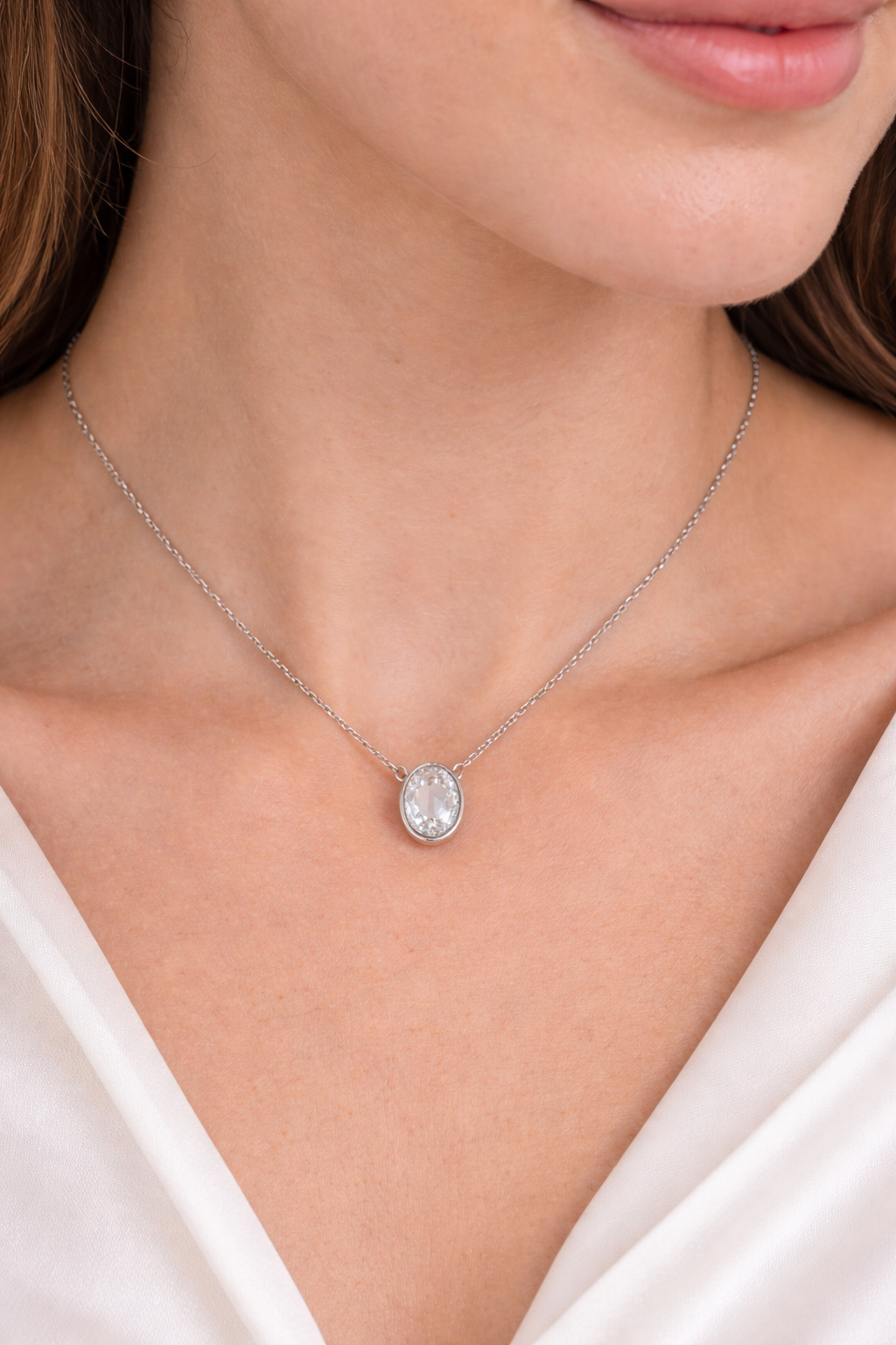 Sterling silver with rhodium, 9.5x12mm oval cubic zirconia necklace, 16″ + 2″ extension